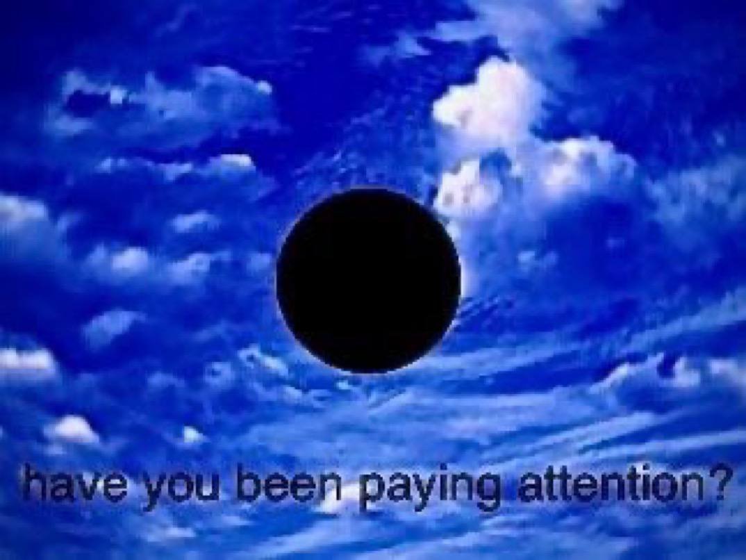 Black sphere floating in an artificial blue sky with the caption: have you been paying attention?